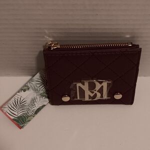 Nwt Badgley mischka wallet has a flaw by the zipper in photos (unisex)